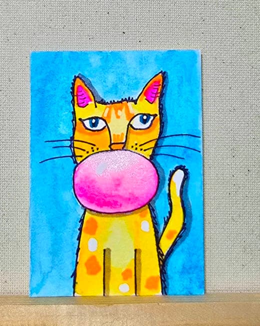 Ginger Cat Blows A Bubble
